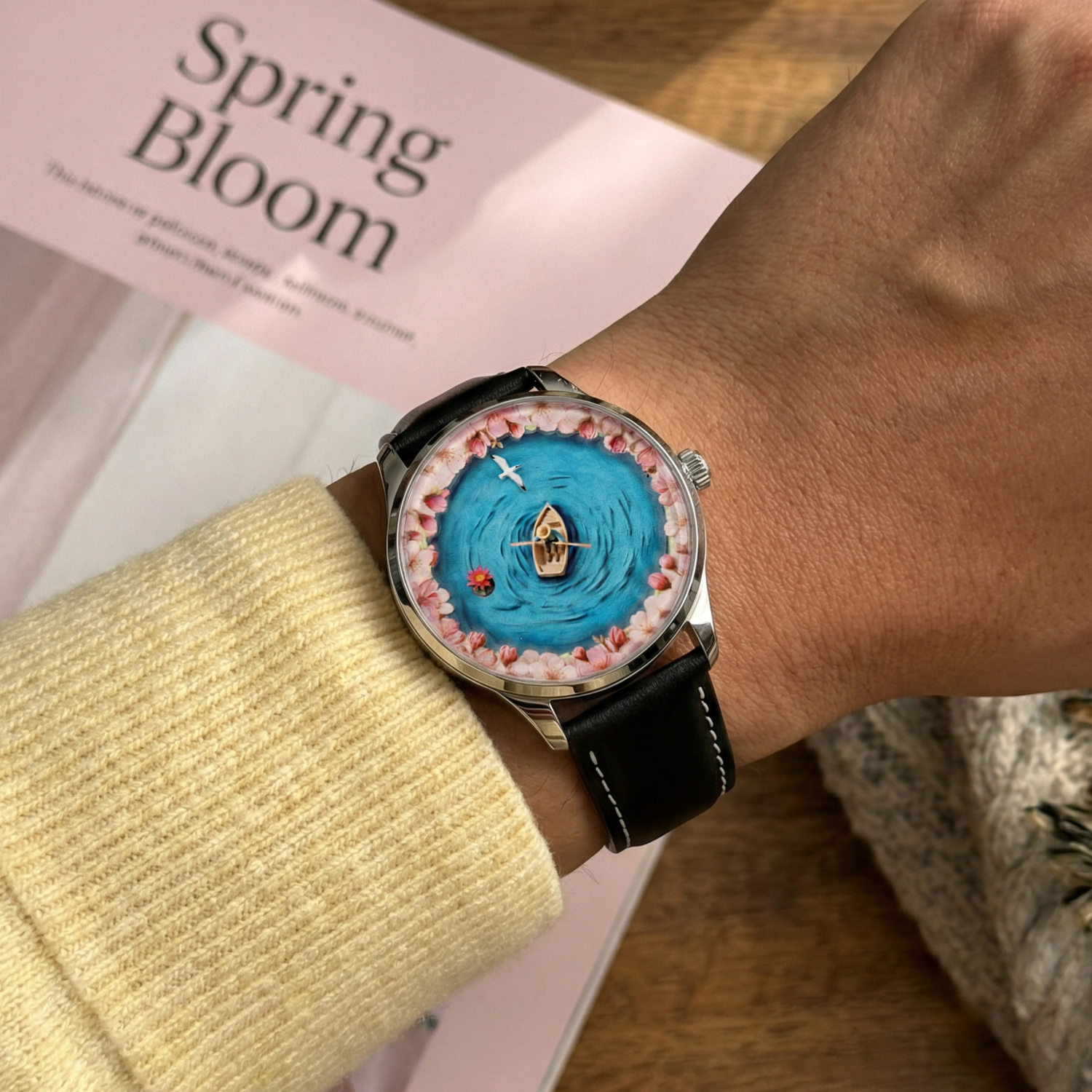 Watch with a unique design on a wrist, placed on a magazine titled 'Spring Bloom'. NEAT Watches